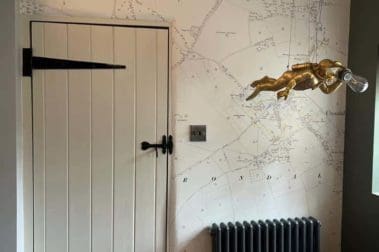 historical property with freshly painted internal door and rustic map wallpaper by painters in Guildford