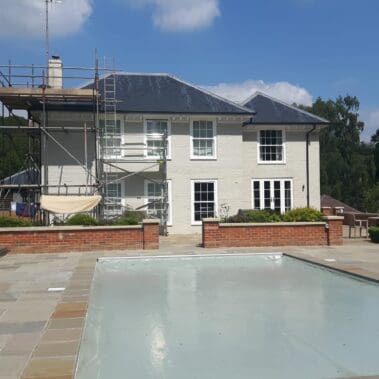 Painting exterior of country home