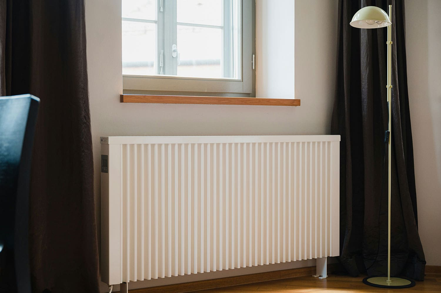 painting behind white radiator in home renovation