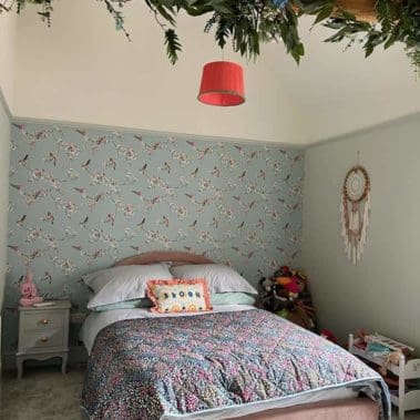 guest bedroom with freshly painted interior, wallpaper fitted and decorated with bed