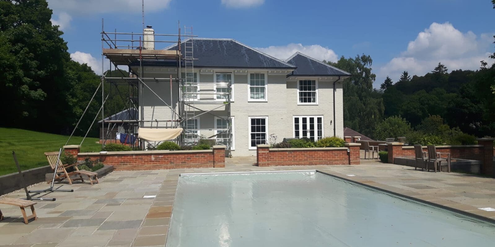 Painting exterior of country home