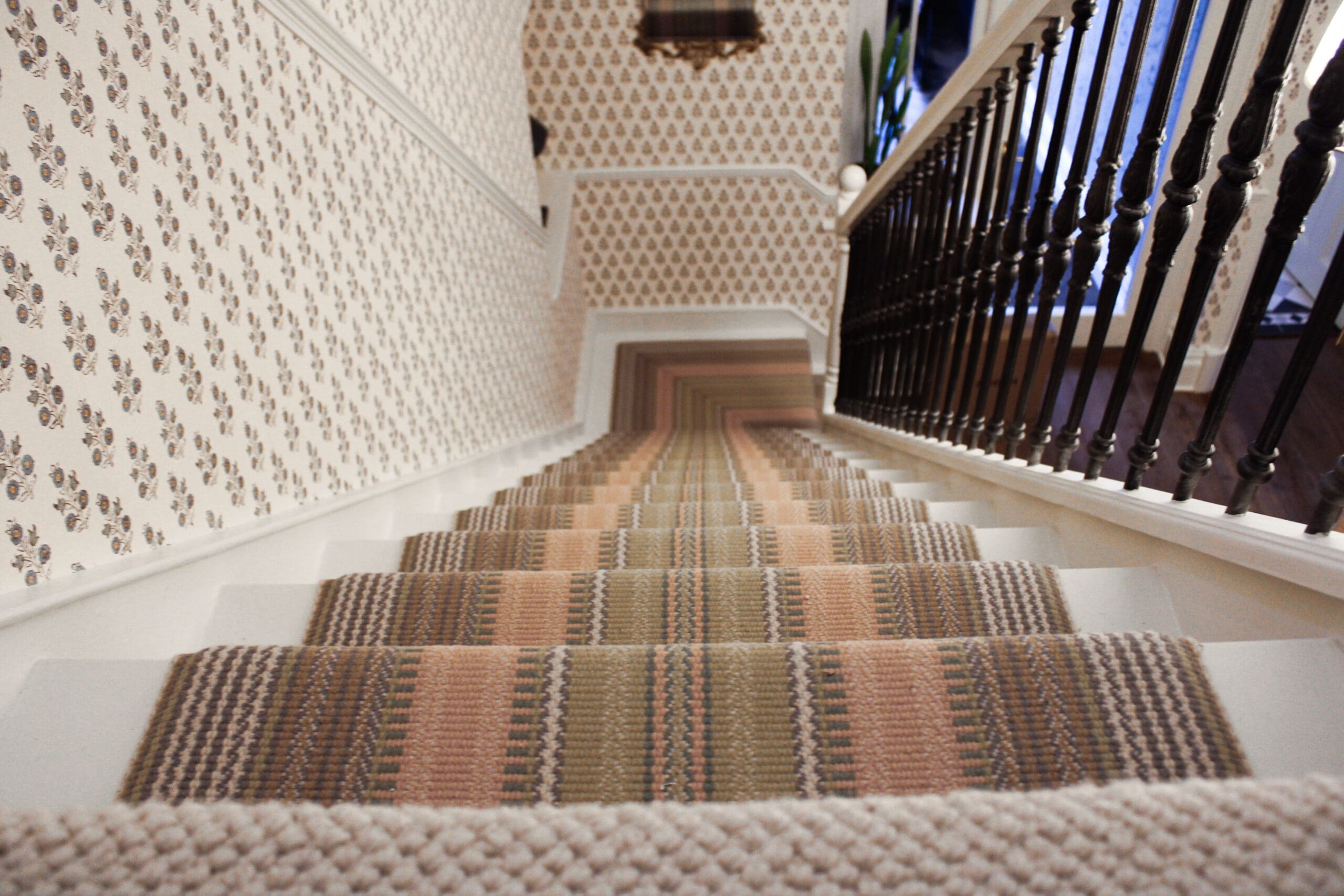 wallpaper in hallway and staircase in surrey home